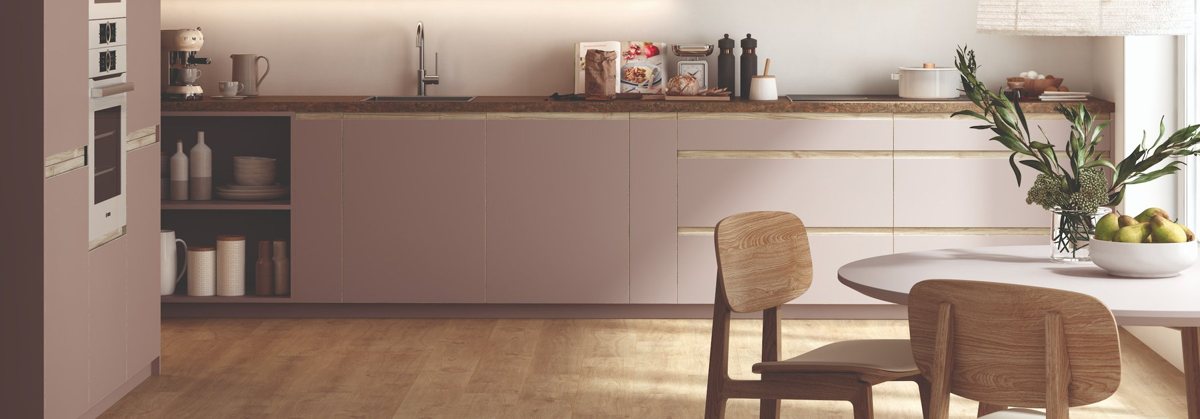 ALVIC Tortora cabinetry in ZENIT super matt beside warm walnut fronts and a stone worktop