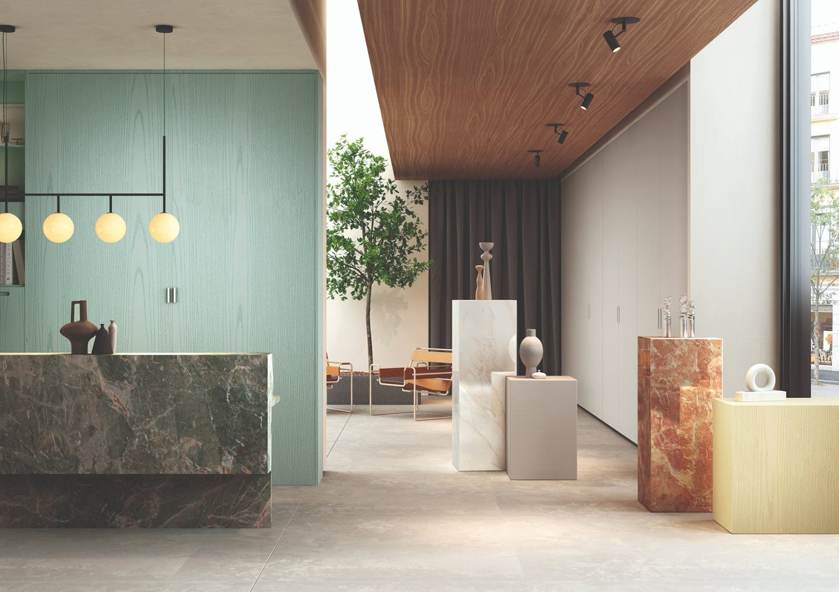 Deep green ALVIC Sierra 02 marble-effect cabinetry with pale mineral seams