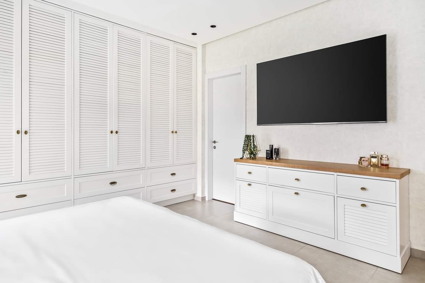 Black Oak and Ochre Apartment — walk-in closets by iKitchen Cabinetry