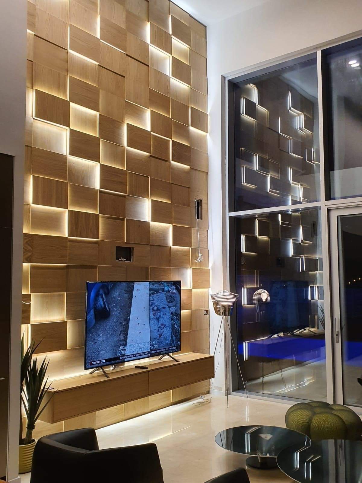 Brass block feature wall with recessed display niches — custom media wall by iKitchen Cabinetry