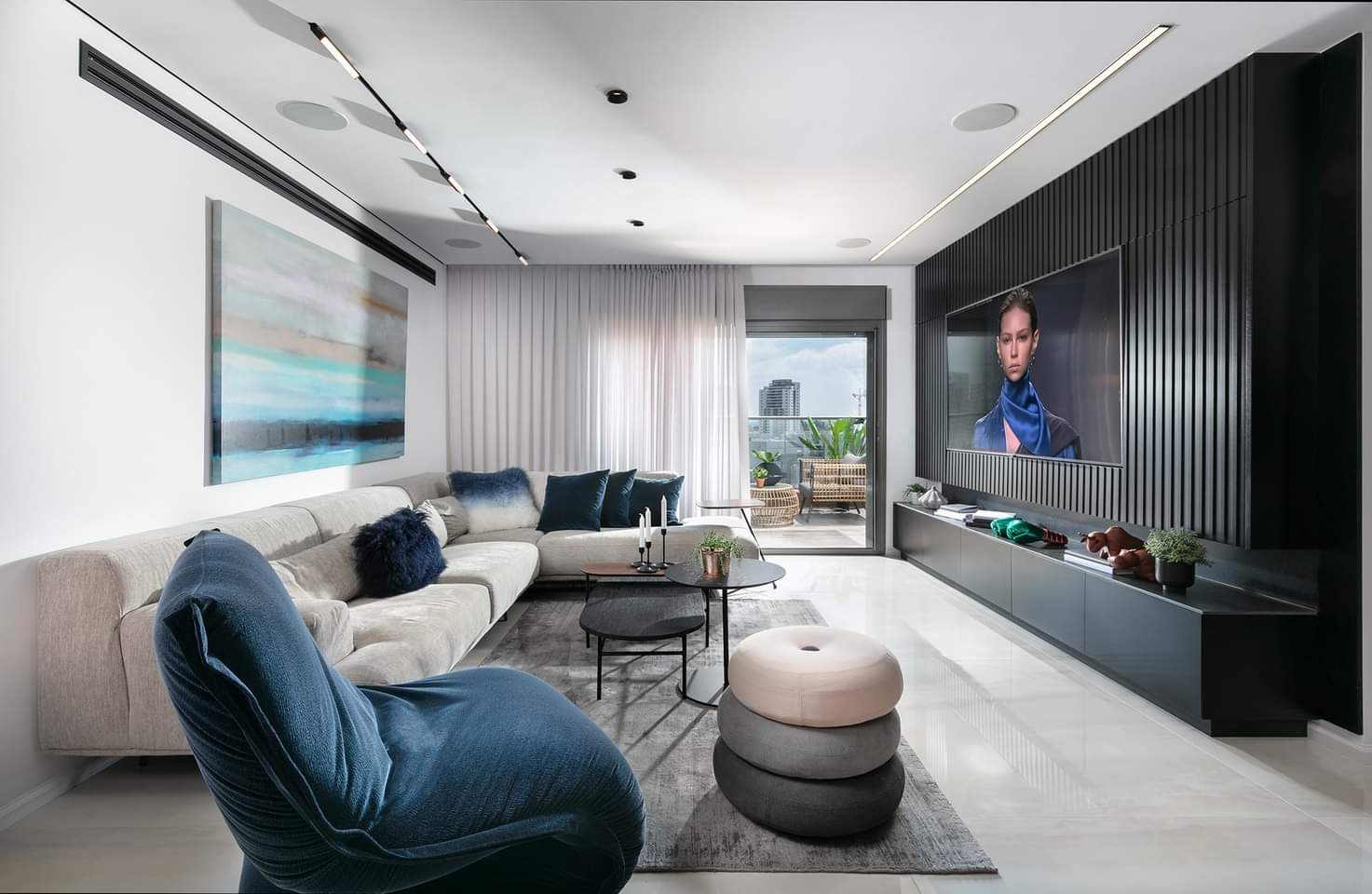 Ribbed wall and a full-width floating cabinet — custom media wall by iKitchen Cabinetry