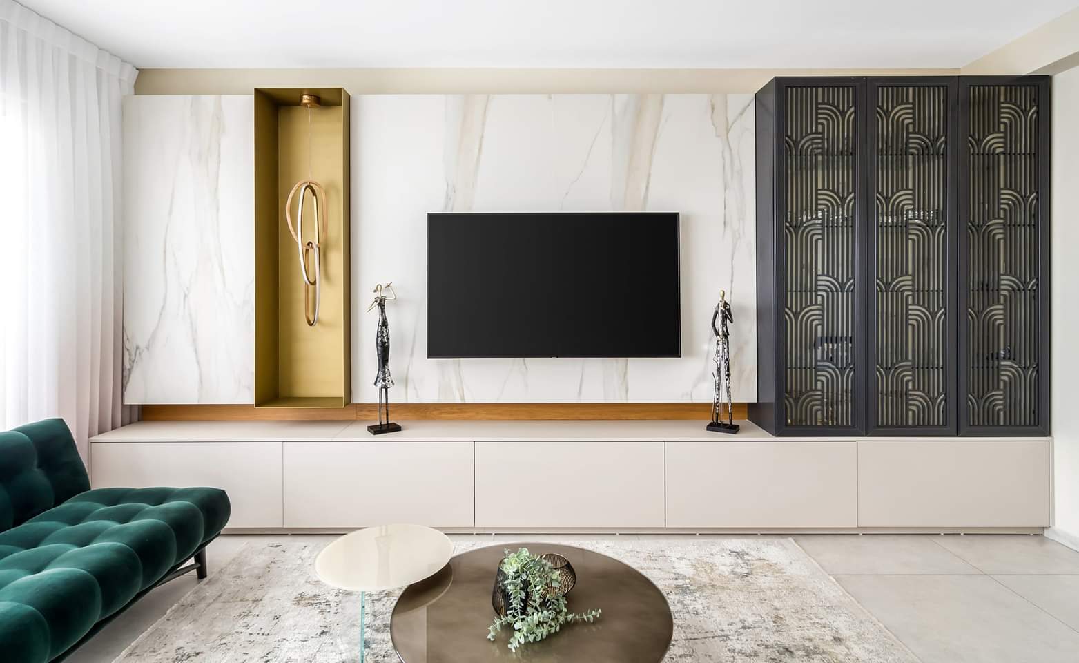 Stone wall, lit niches and a bronze mesh cabinet — custom media wall by iKitchen Cabinetry